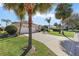 Single story home with a two car garage and palm trees at 1982 Somerset Ave, The Villages, FL 32162