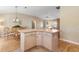 L shaped kitchen island with wood cabinets at 1982 Somerset Ave, The Villages, FL 32162