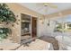 Relaxing screened porch with brick patio and wicker furniture at 1982 Somerset Ave, The Villages, FL 32162