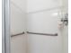 Walk-in shower with grab bars for accessibility at 1982 Somerset Ave, The Villages, FL 32162