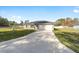 Newly built house with driveway and grassy yard at 200 Oak Lane Run, Ocala, FL 34472