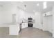 Contemporary kitchen featuring white shaker cabinets and granite countertops at 200 Oak Lane Run, Ocala, FL 34472