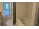 A bathroom featuring a soaking tub with chrome fixtures at 2158 Nw 23Rd Loop, Ocala, FL 34475