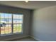 Bedroom featuring carpet, natural light from the window, and neutral paint at 2158 Nw 23Rd Loop, Ocala, FL 34475