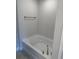 Clean, modern bathroom featuring a white soaking tub, brushed nickel fixtures, and neutral walls at 2162 Nw 23Rd Loop, Ocala, FL 34475