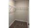 Walk-in closet with carpet flooring and wired shelving for optimal storage space at 2162 Nw 23Rd Loop, Ocala, FL 34475