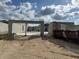 New home construction site showing the early building phases and concrete block walls under a cloudy sky at 2162 Nw 23Rd Loop, Ocala, FL 34475