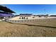 Large equestrian arena with stadium seating and show jumping course at 2162 Nw 23Rd Loop, Ocala, FL 34475