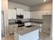 Beautiful kitchen featuring granite countertops, stainless steel appliances, and an island with a double sink at 2162 Nw 23Rd Loop, Ocala, FL 34475