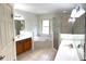 Main bathroom with double vanity, soaking tub and shower at 21962 Sw Nautilus Blvd, Dunnellon, FL 34431