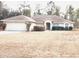 One-story house with attached garage and manicured lawn at 21962 Sw Nautilus Blvd, Dunnellon, FL 34431