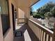 Private balcony with railings overlooking trees and parking at 2418 Ne 7Th St # 9, Ocala, FL 34470