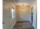 Simple dining area with chandelier and new flooring at 2418 Ne 7Th St # 9, Ocala, FL 34470