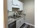 Modern kitchen with stainless steel appliances and granite counters at 2418 Ne 7Th St # 9, Ocala, FL 34470