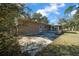 Home's backyard with patio and large yard at 2645 Se 162Nd Place Rd, Summerfield, FL 34491