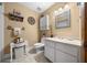 Charming bathroom with white vanity and decorative accents at 2645 Se 162Nd Place Rd, Summerfield, FL 34491