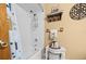 Clean bathroom with shower/tub combo and white tile at 2645 Se 162Nd Place Rd, Summerfield, FL 34491