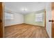 Bright bedroom with wood flooring and two windows at 2645 Se 162Nd Place Rd, Summerfield, FL 34491