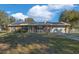 Ranch-style home with solar panels, a two-car garage, and a spacious yard at 2645 Se 162Nd Place Rd, Summerfield, FL 34491