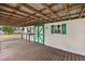 Spacious back porch with attached workshop and wooden flooring at 2883 Sw 66Th St, Ocala, FL 34476