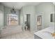 Primary bathroom featuring a garden tub, separate toilet room, and tile flooring at 2883 Sw 66Th St, Ocala, FL 34476