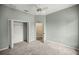 Bedroom with carpeted floors, a ceiling fan, and a closet space at 2883 Sw 66Th St, Ocala, FL 34476