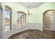 Bright dining room featuring hardwood floors and a charming chandelier at 2883 Sw 66Th St, Ocala, FL 34476