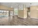 Open floor plan with hardwood floors, leading to a screened lanai overlooking the pool and backyard at 2883 Sw 66Th St, Ocala, FL 34476