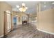 Open concept living space with hardwood floors, neutral paint, built-in fireplace, and sliding glass doors at 2883 Sw 66Th St, Ocala, FL 34476