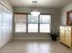 Bright dining area with large windows and tile floors at 4036 Sw 57Th Ct, Ocala, FL 34474