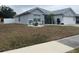 Single-story home with a well-maintained lawn and landscaping at 4036 Sw 57Th Ct, Ocala, FL 34474