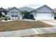 Well-maintained single-story home with a two-car garage and landscaping at 4036 Sw 57Th Ct, Ocala, FL 34474