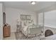 Cozy bedroom with a metal bed frame and neutral color scheme at 4775 Nw 35Th Lane Rd, Ocala, FL 34482