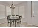 Charming dining room with a round table, four chairs, and a chandelier at 4775 Nw 35Th Lane Rd, Ocala, FL 34482