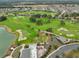 Aerial view of community golf course and surrounding neighborhood at 4775 Nw 35Th Lane Rd, Ocala, FL 34482