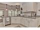 Modern kitchen featuring white cabinets, granite countertops, and pendant lighting at 4775 Nw 35Th Lane Rd, Ocala, FL 34482