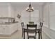 Kitchen features a dining area and white shaker cabinets at 4775 Nw 35Th Lane Rd, Ocala, FL 34482