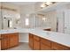 Bathroom with double sinks and wood cabinets at 4945 Nw 33Rd Ln, Ocala, FL 34482