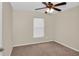 Bedroom with carpet, ceiling fan and window at 4945 Nw 33Rd Ln, Ocala, FL 34482