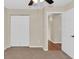 Bedroom with carpet, double closet and door to hallway at 4945 Nw 33Rd Ln, Ocala, FL 34482