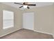 Bedroom with carpet, ceiling fan, and double closet at 4945 Nw 33Rd Ln, Ocala, FL 34482