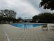 Community swimming pool with lounge chairs at 4945 Nw 33Rd Ln, Ocala, FL 34482