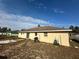 Home's rear elevation showcasing a patio and a large yard at 5242 Sw 162Nd Place Rd, Ocala, FL 34473