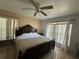 Primary bedroom with a king-size bed and large windows at 5242 Sw 162Nd Place Rd, Ocala, FL 34473