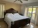 Spacious bedroom with a king-size bed and large windows at 5242 Sw 162Nd Place Rd, Ocala, FL 34473