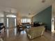 Living room with high ceilings, a neutral color scheme, and tiled flooring at 5242 Sw 162Nd Place Rd, Ocala, FL 34473