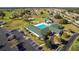 Aerial view of community pool, clubhouse, and tennis courts at 5470 Nw 26Th Lane, Ocala, FL 34482