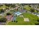 Aerial view of community clubhouse, pool, and tennis courts at 5470 Nw 26Th Lane, Ocala, FL 34482