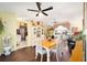 Charming dining area with wood table and white chairs at 5470 Nw 26Th Lane, Ocala, FL 34482