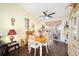 Bright dining room with wooden table and access to the patio at 5470 Nw 26Th Lane, Ocala, FL 34482